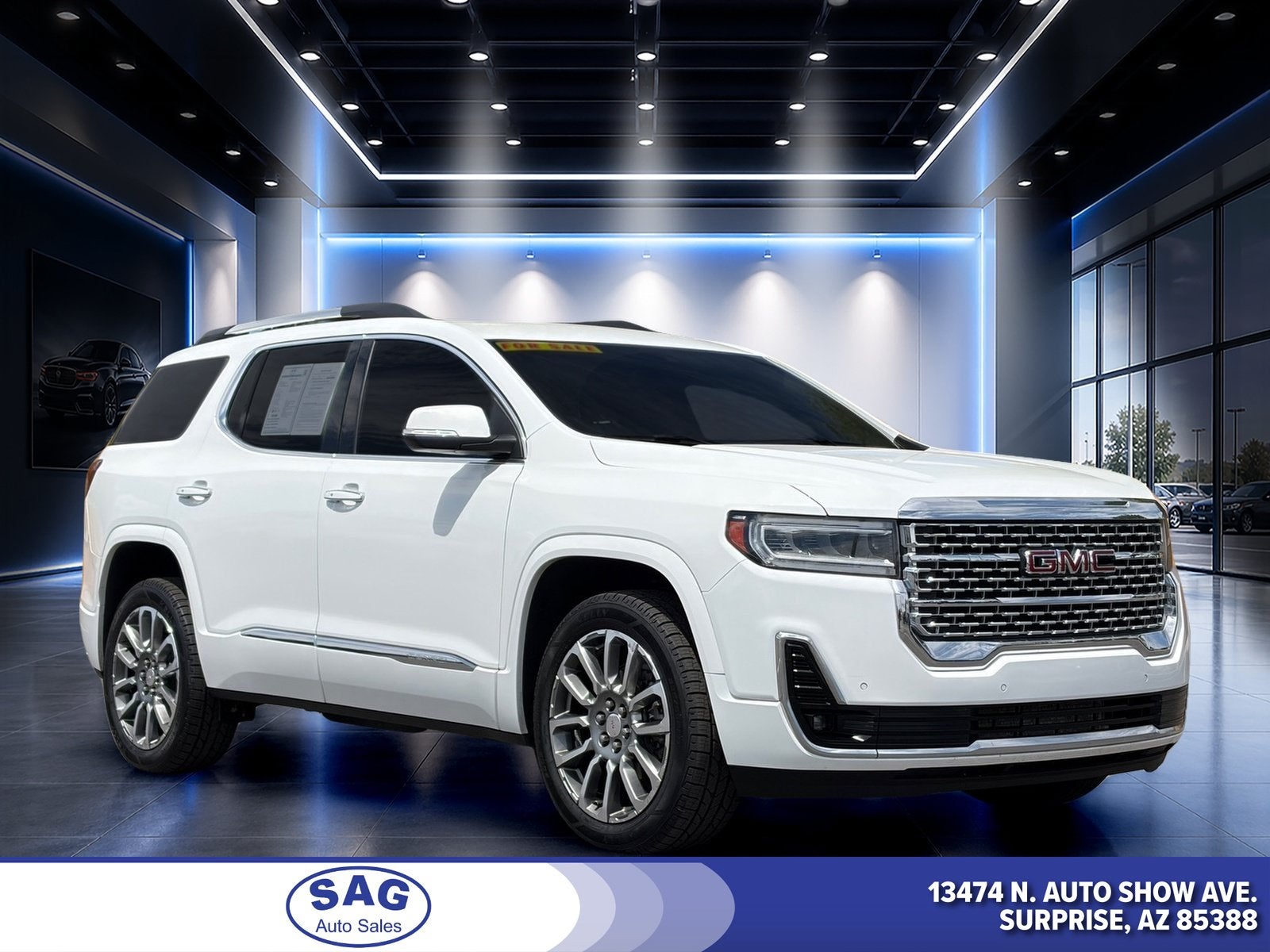 2023 GMC Acadia Denali in Summit White — front three-quarter view